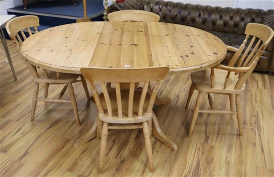 A pine extending dining table and four chairs, W.159cm fully extended with 1 leaf